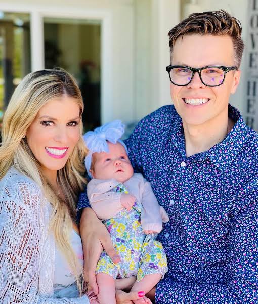 rebecca zamolo with her husband and daughter